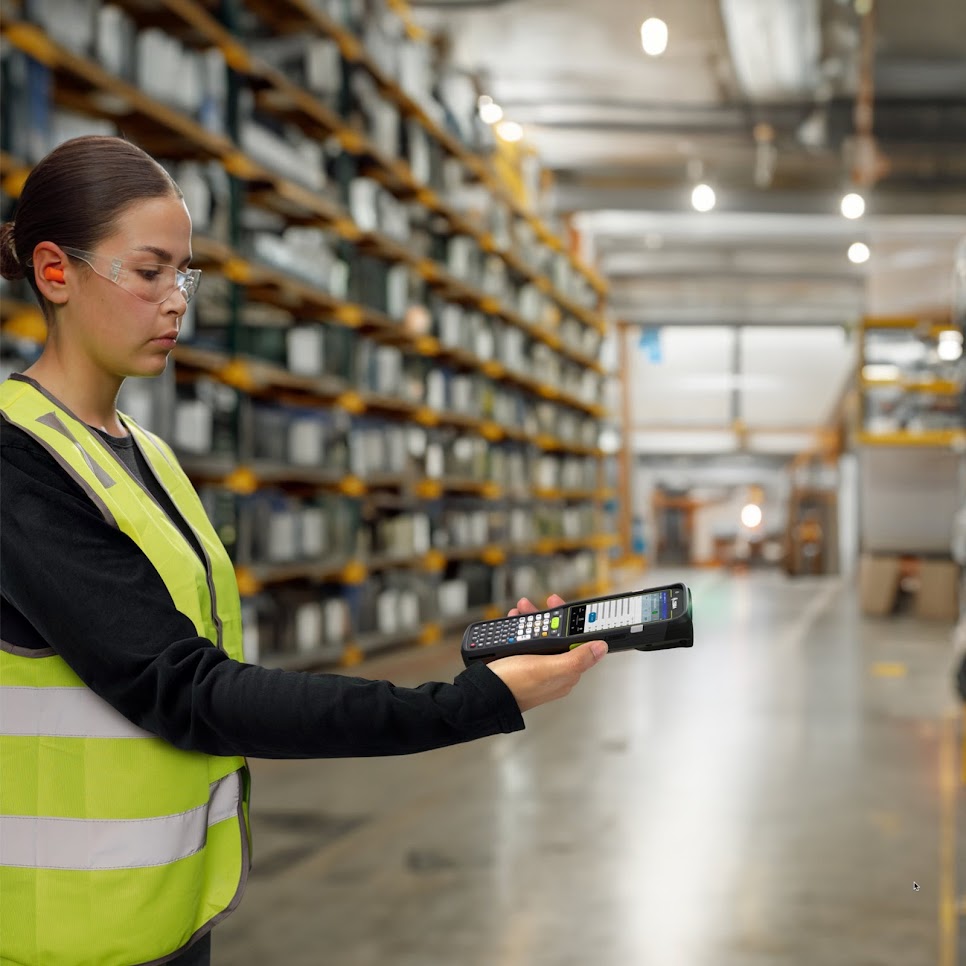 Worker using Zebra MC3400 keypad in warehouse