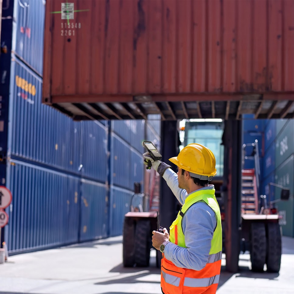 Warehouse worker using Zebra MC3400 for scanning