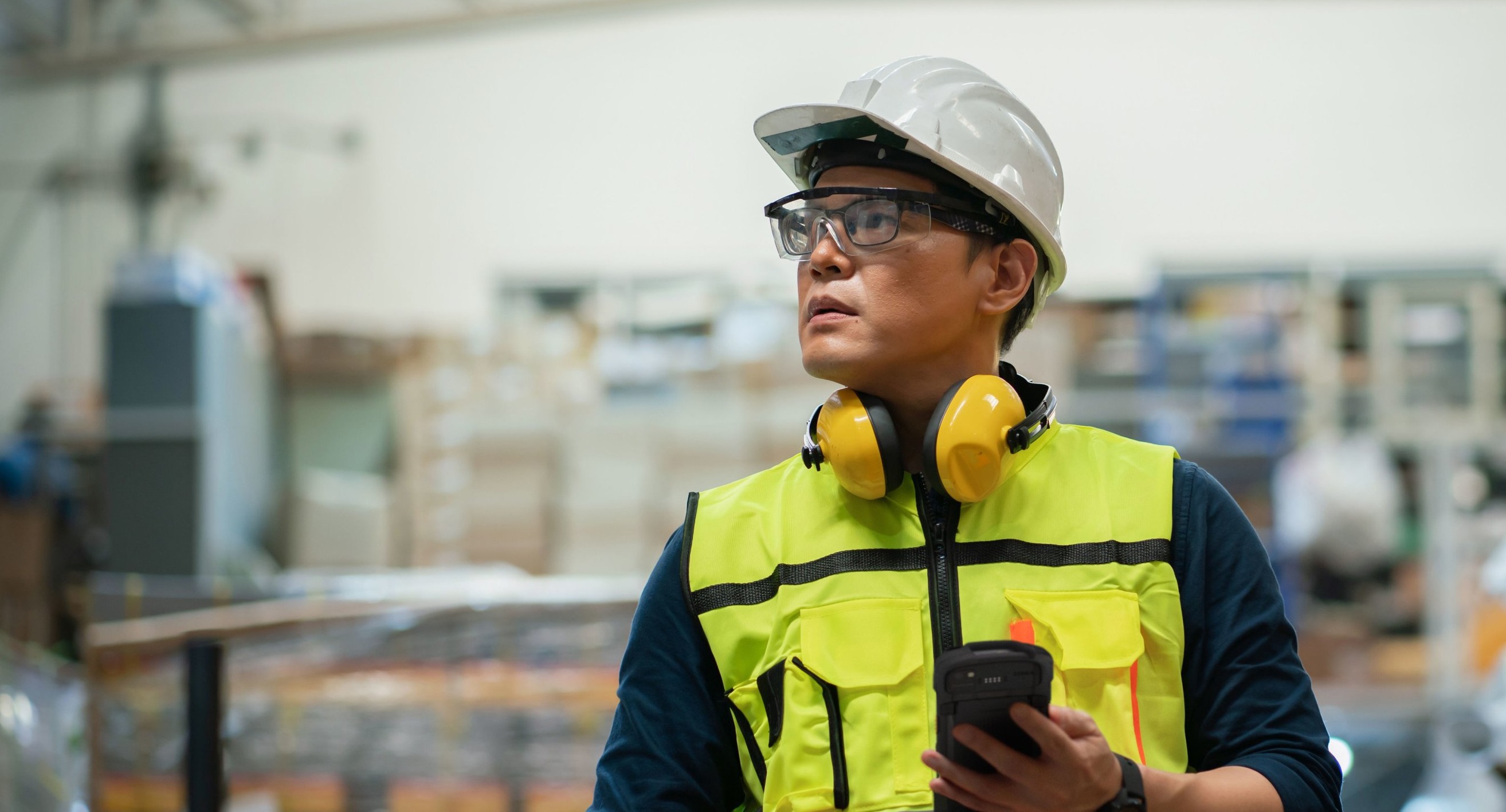 Warehouse professional using mobile device